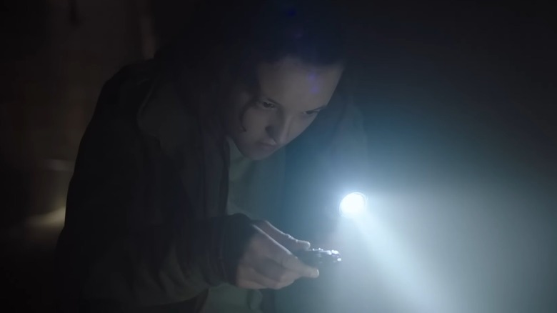 Ellie using her flashlight