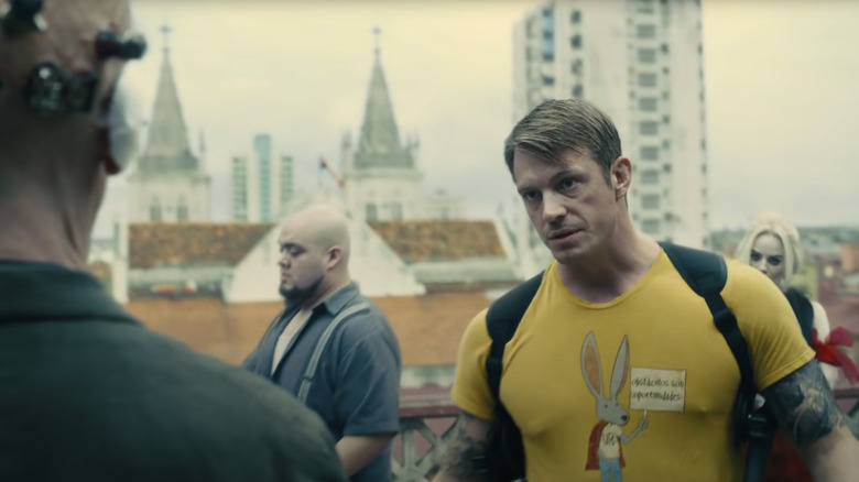 Margot Robbie, Joel Kinnaman and Julio Ruiz in "The Suicide Squad"