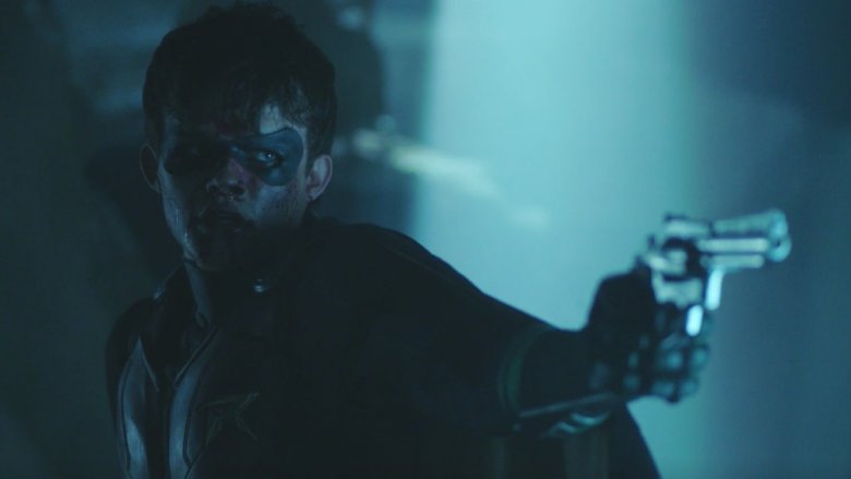 Curran Walters as Jason Todd with Joe Chill's gun