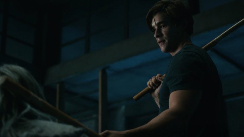 Dick Grayson with his batons