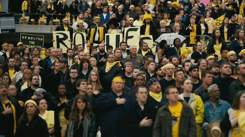 Robin-style "R" sign in a sports crowd