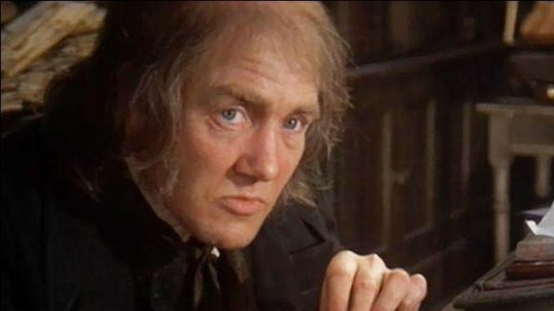 Finney as Scrooge counting money