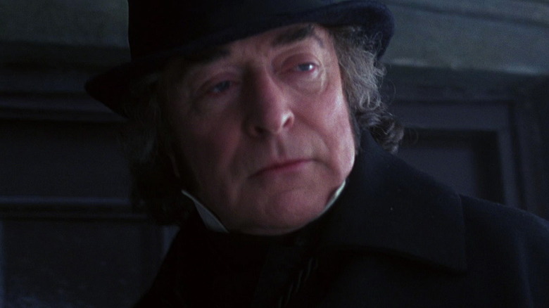 Michael Caine mugs as Scrooge