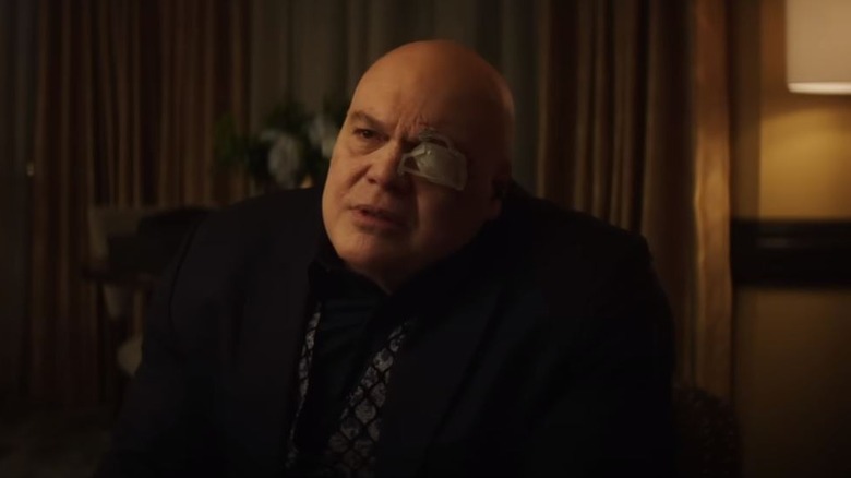 Kingpin with bandage over eye