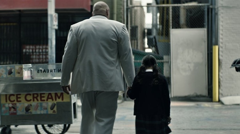 Kingpin and Maya holding hands