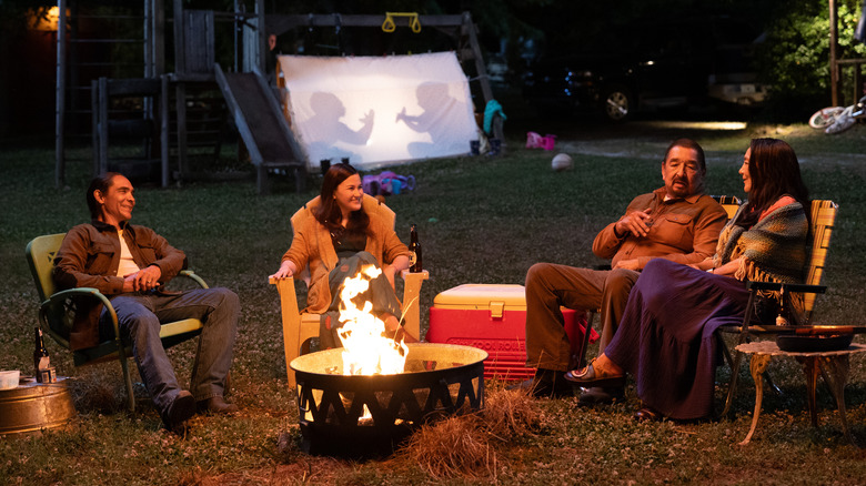 William, Bonnie, Skully, and Chula sitting by fire