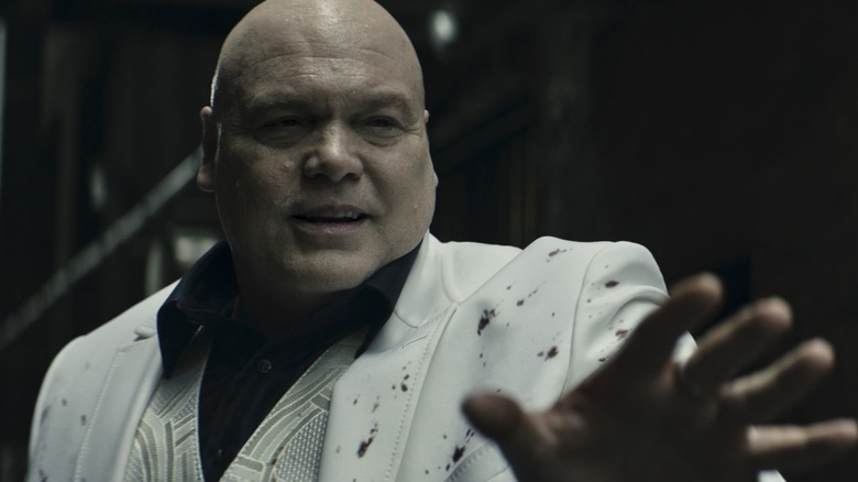 Kingpin raising his hand