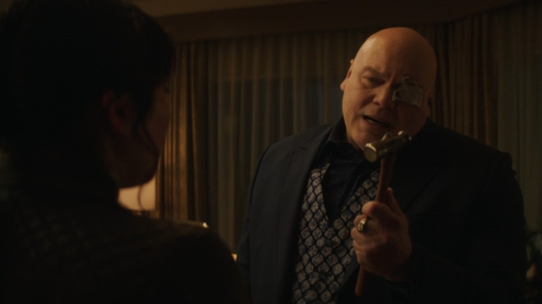 Kingpin holding hammer