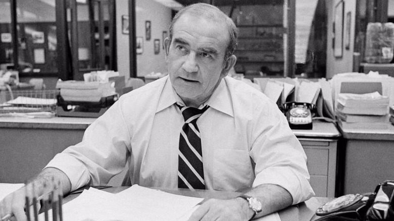 Lou Grant at desk