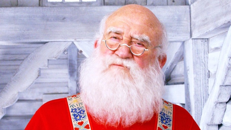 Ed Asner as Santa in suspenders