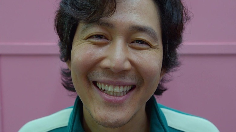 Seong Gi-hun smiling green tracksuit