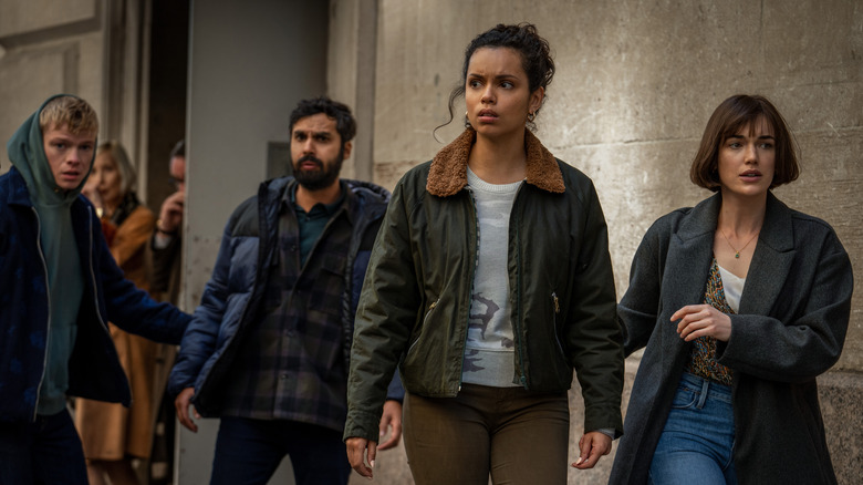 Tom Rhys Harries, Kunal Nayyar, Georgina Campbell and Elizabeth Henstridge on the street in "Suspicion"