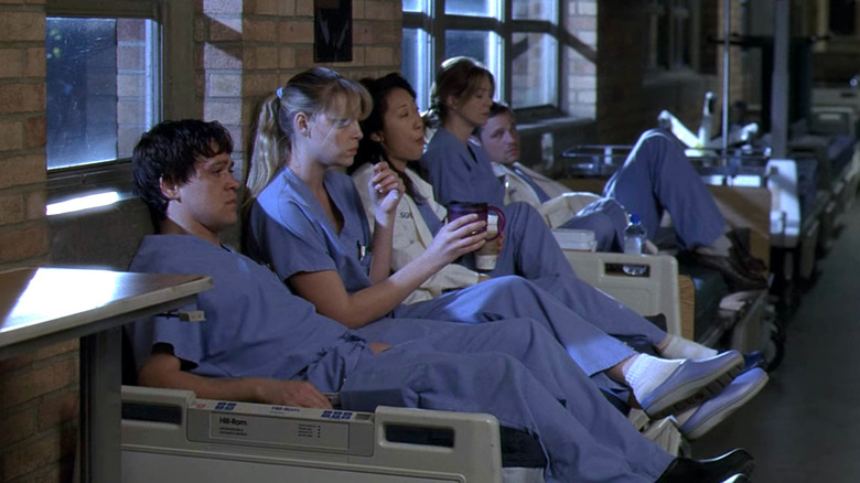 Grey's Anatomy interns sitting on hospital beds