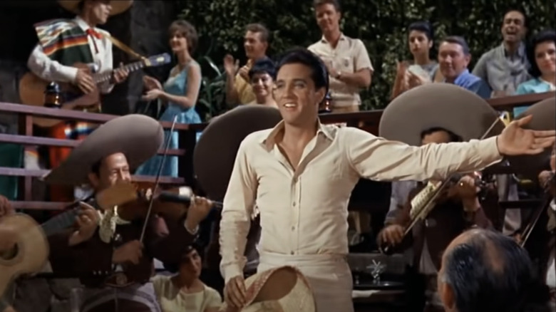 Elvis Presley with Mariachi band and crowd