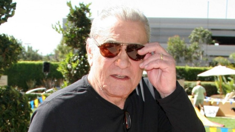 James Farentino fixing sunglasses