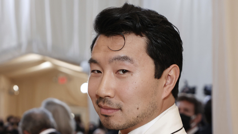 Simu Liu grins at the 2021 Met Gala