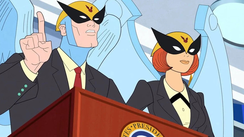 Birdgirl and Birdman at lectern