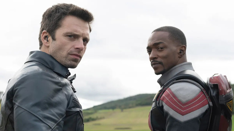 Bucky and Falcon look over their shoulders