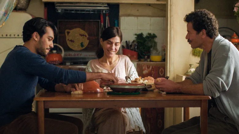 Halim, Mina, and Youssef sit at a table