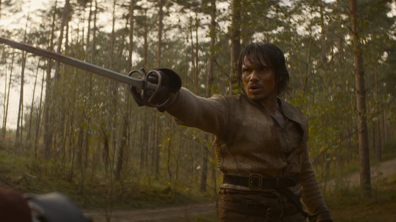 D'Artagnan points sword in forest