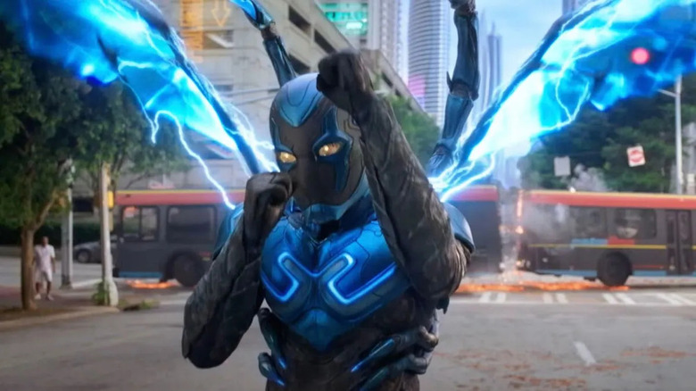 Blue Beetle sticking fists up