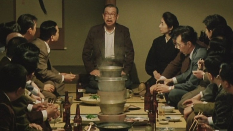 Group of people sitting by meal