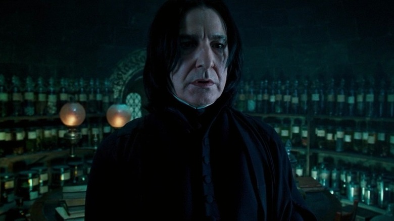 Severus Snape in front of potions bottles