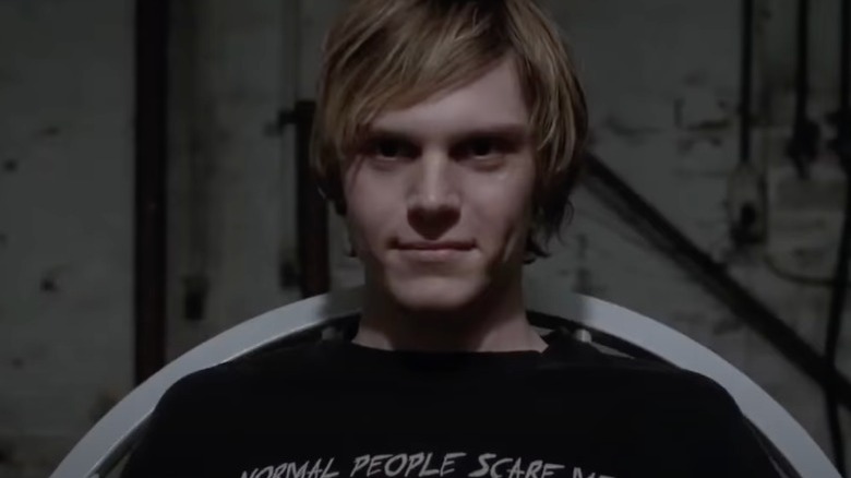 Evan Peters smirks