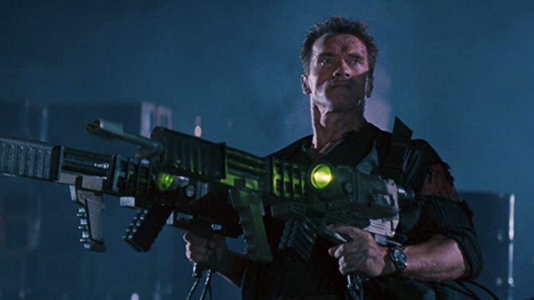 Arnold holds two big guns