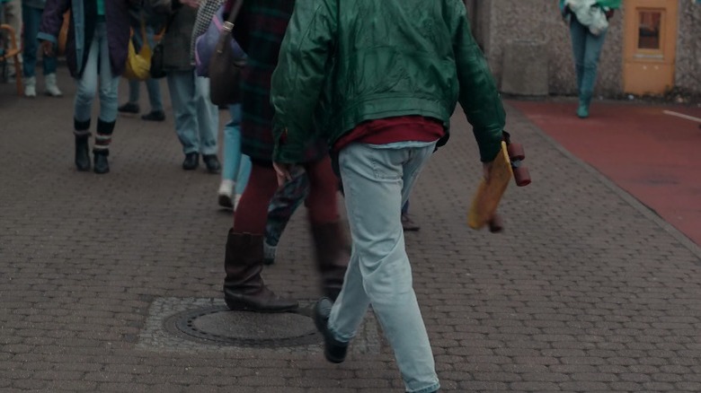 Teenage boy flipping a skateboard into his hand