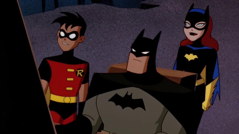 Batman, Robin and Batgirl in the batcave