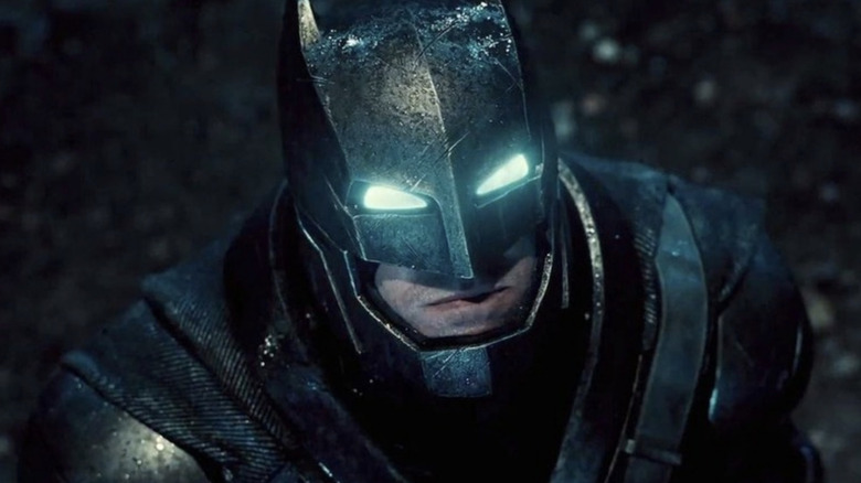 An armored Batman looks upward in Batman v Superman: Dawn of Justice