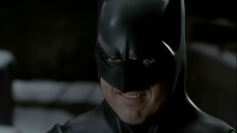 Batman smiles at his opponent in Batman Returns