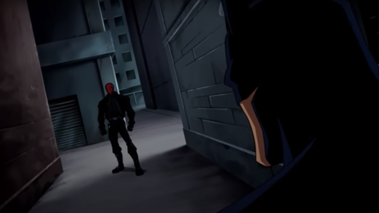 Batman confronts the Red Hood