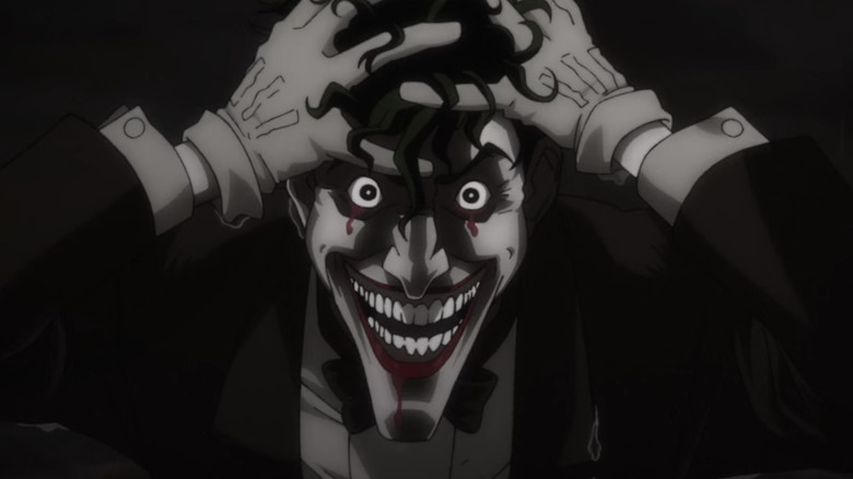 Joker holding his head