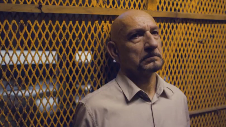 Ben Kingsley scowling in an elevator