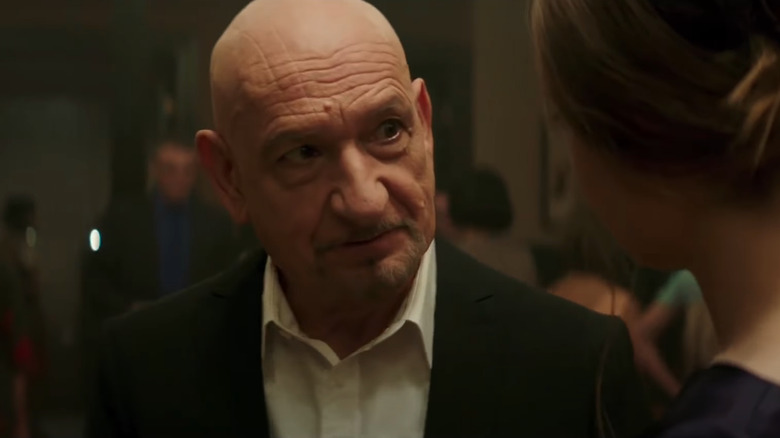 Ben Kingsley in a suit with a woman