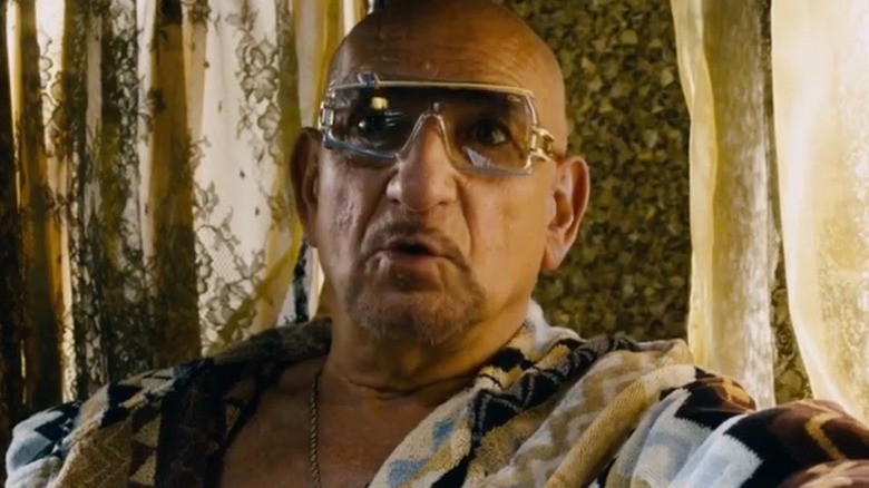 Ben Kingsley in sunglasses and robe