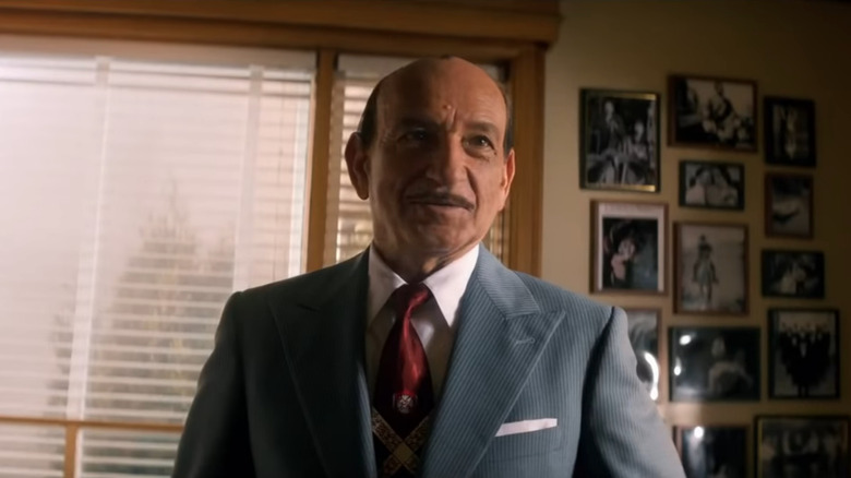 Ben Kingsley in suit with pencil mustache