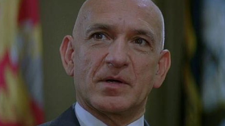 Ben Kingsley talking in suit