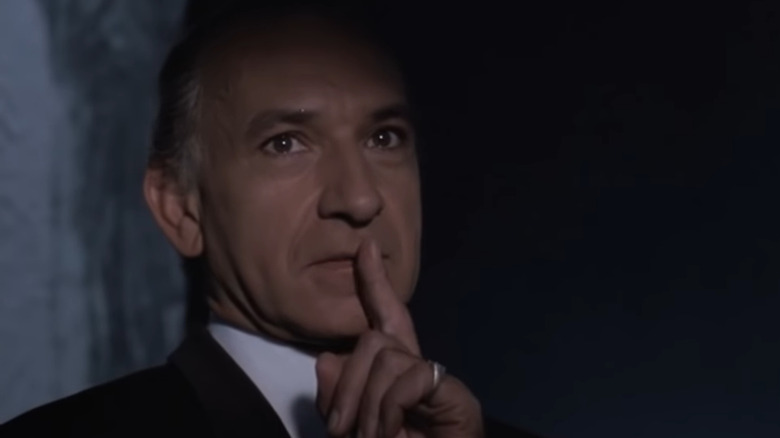 Ben Kingsley holding finger to lips