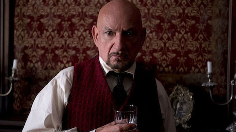 Ben Kingsley in red sweater vest