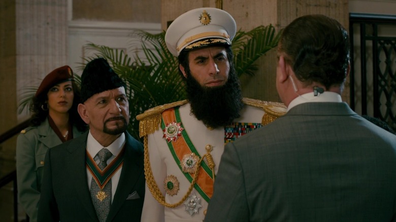 Ben Kingsley and Sacha Baron Cohen standing in a hotel