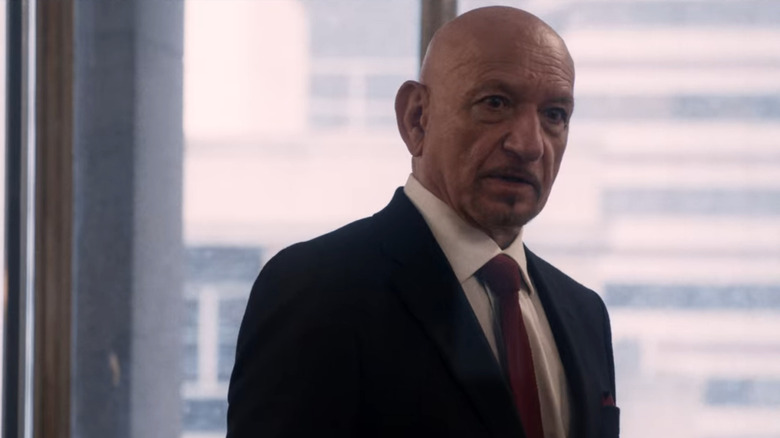 Ben Kingsley wearing suit and red tie