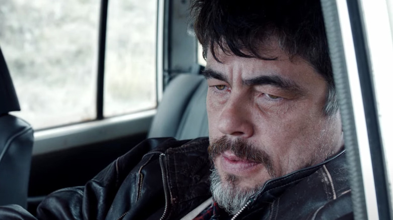 Benicio Del Toro in truck