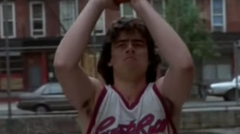 Benicio Del Toro playing basketball