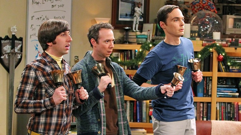 Howard, Stuart, and Sheldon playing bells.