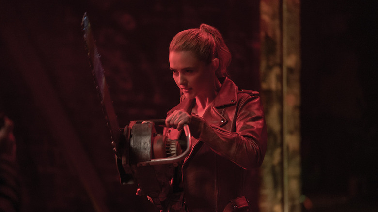 Kathryn Newton wielding a chainsaw