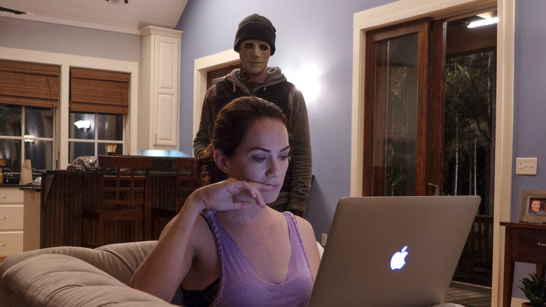 Kate Siegel stalked by a menacing figure