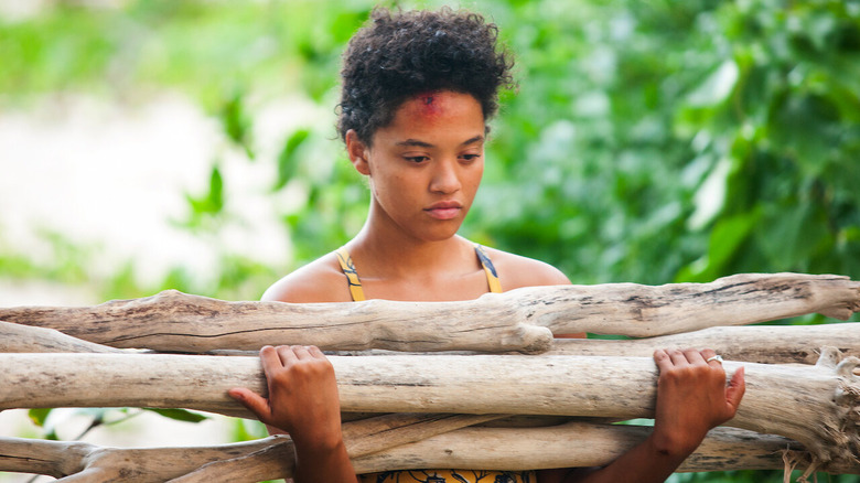 Kiersey Clemons collecting wood